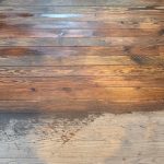 Half of wood floor before and half after cleaning in Latrobe PA