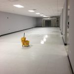 Clean white floor after commercial cleaning with mop bucket in center in North Huntingdon, PA